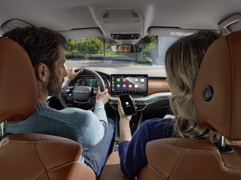 Image of Two Passengers Sitting in the Front of a Skoda Superb